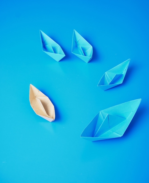 leadership-concept-origami-boat-paper (1)